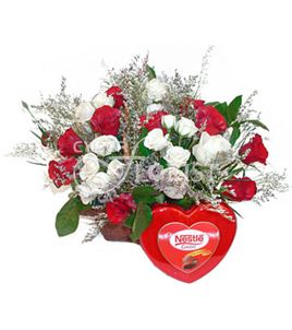 roses in a basket with chocolates
